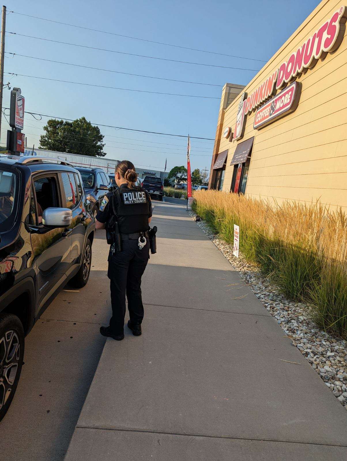 Riley County Police Department Officers standing on a rooftop to raise money for Special Olympics KS
