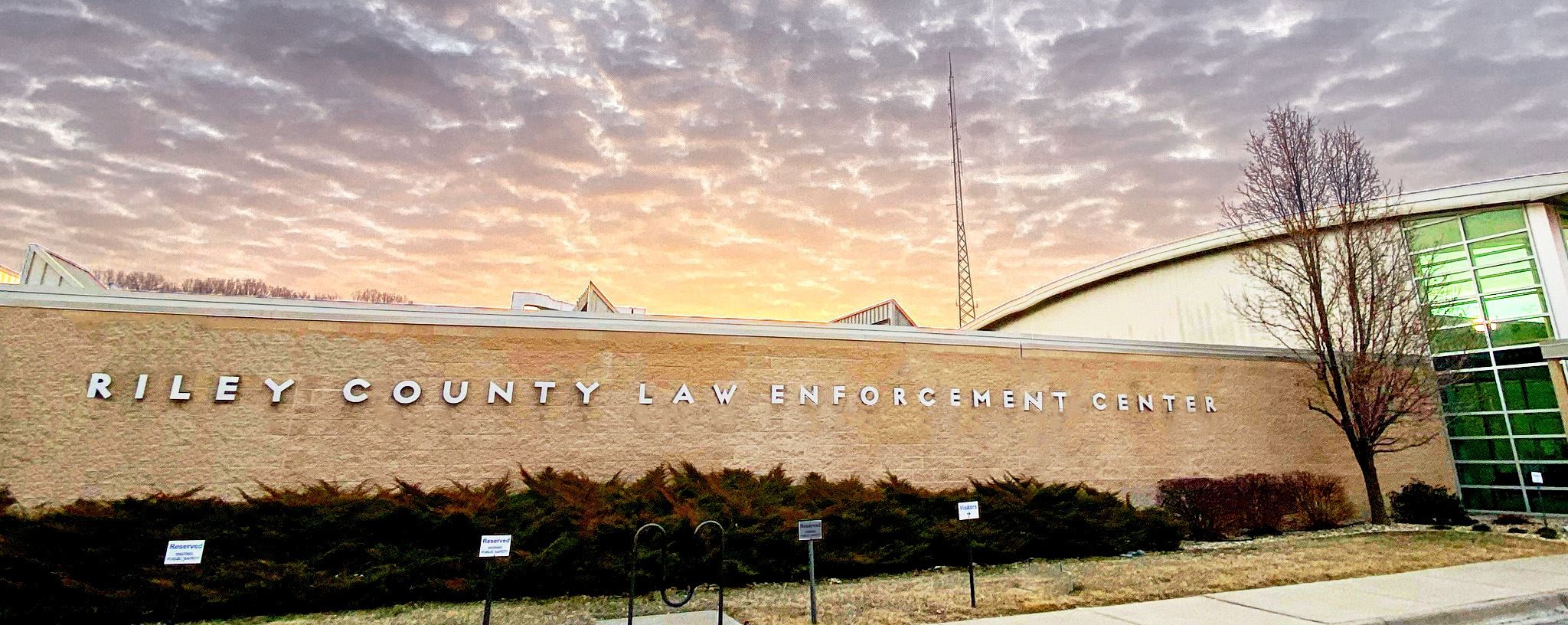 Riley County Law Enforcement Agency Building with a sunset in the background